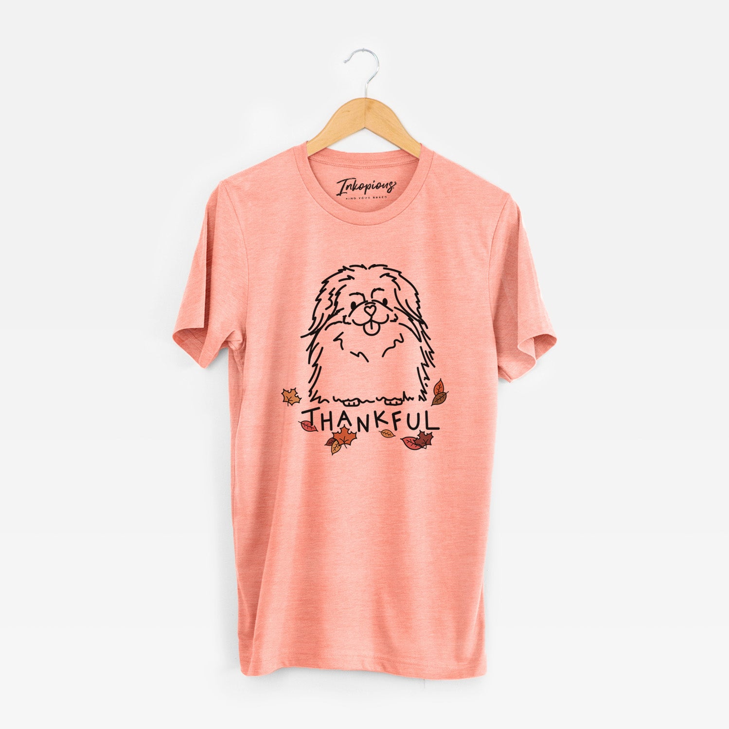 Minimalist line drawing of Viv the Pekingese with 'Thankful' lettering on a Sunset Unisex crewneck