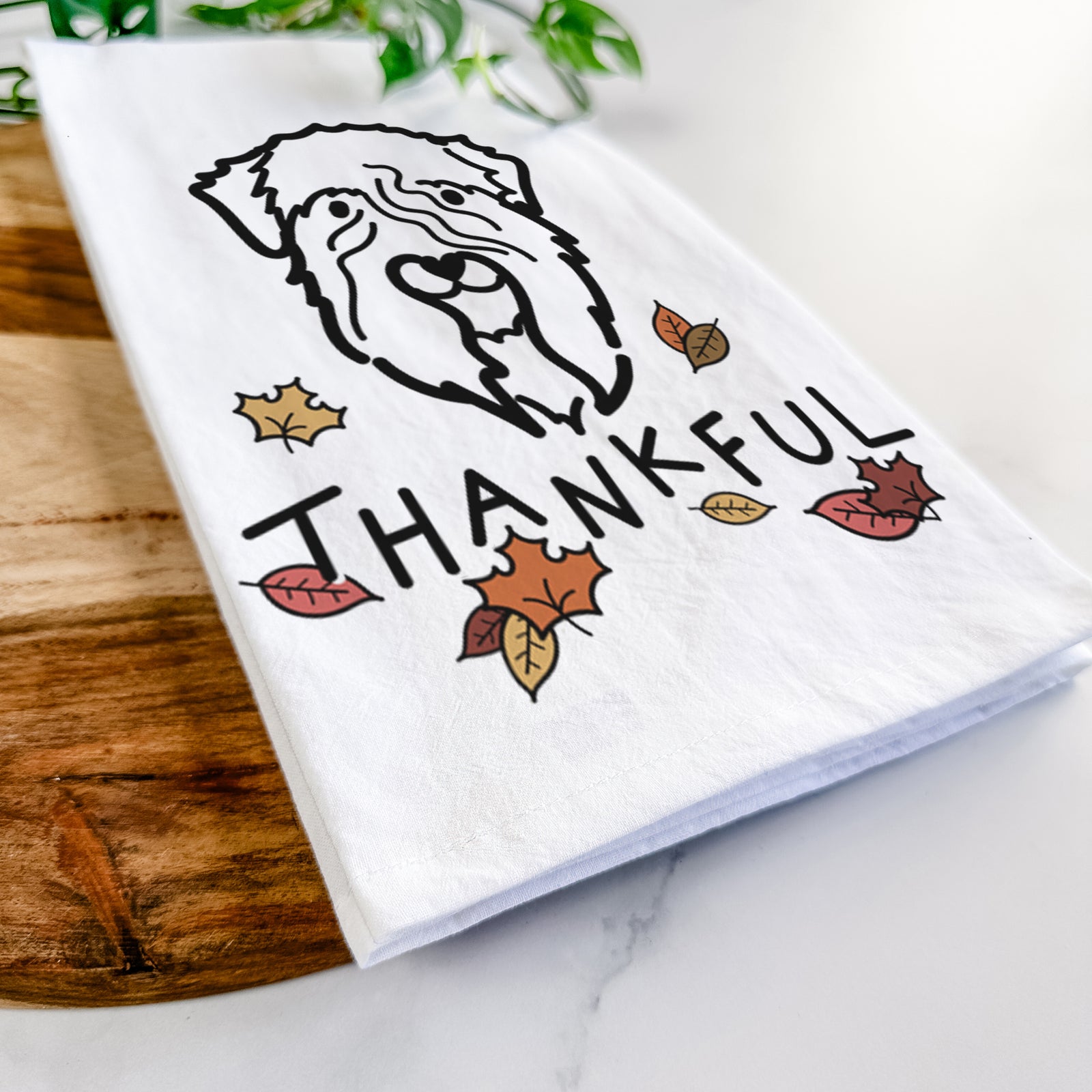 Minimalist line drawing of a Soft Coated Wheaten Terrier with 'Thankful' lettering on a tea towel