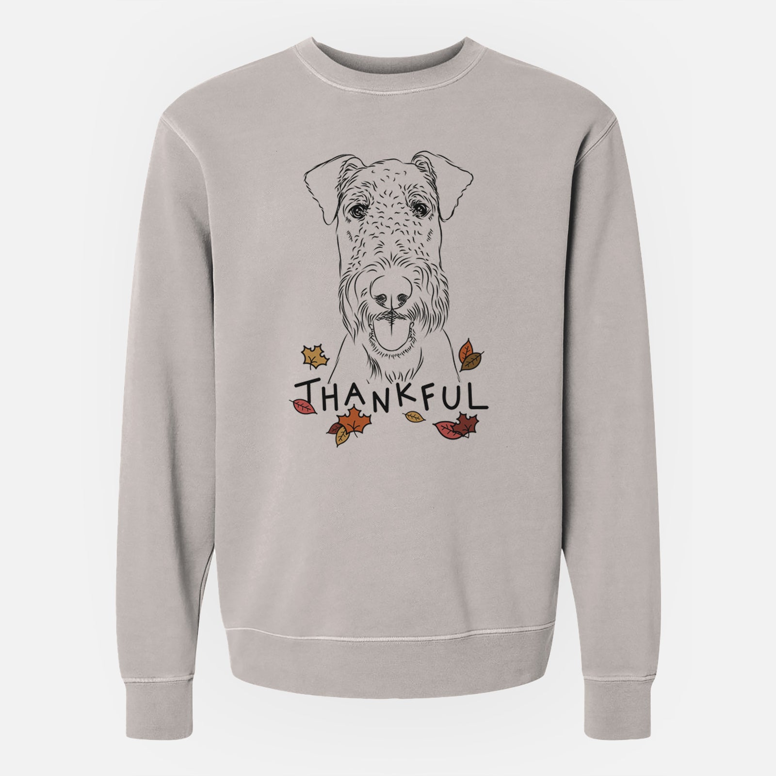 Hand-drawn sketch of Andy the Airedale Terrier with 'Thankful' lettering and autumn leaves on a Cement Unisex pigment dyed crew sweatshirt