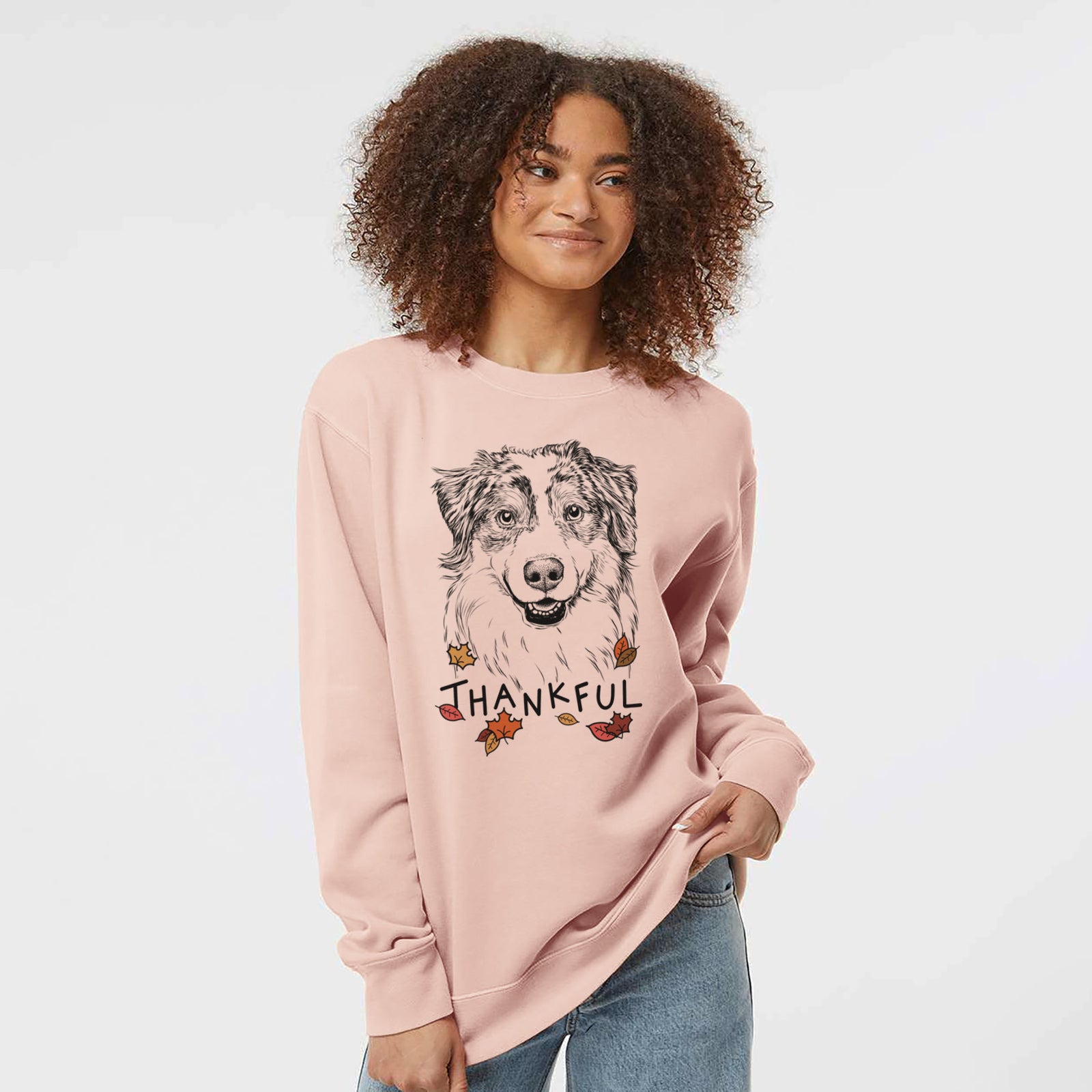 Hand-drawn sketch of Aonghus the Australian Shepherd with 'Thankful' lettering and autumn leaves on a Dusty Pink Unisex pigment dyed crew sweatshirt