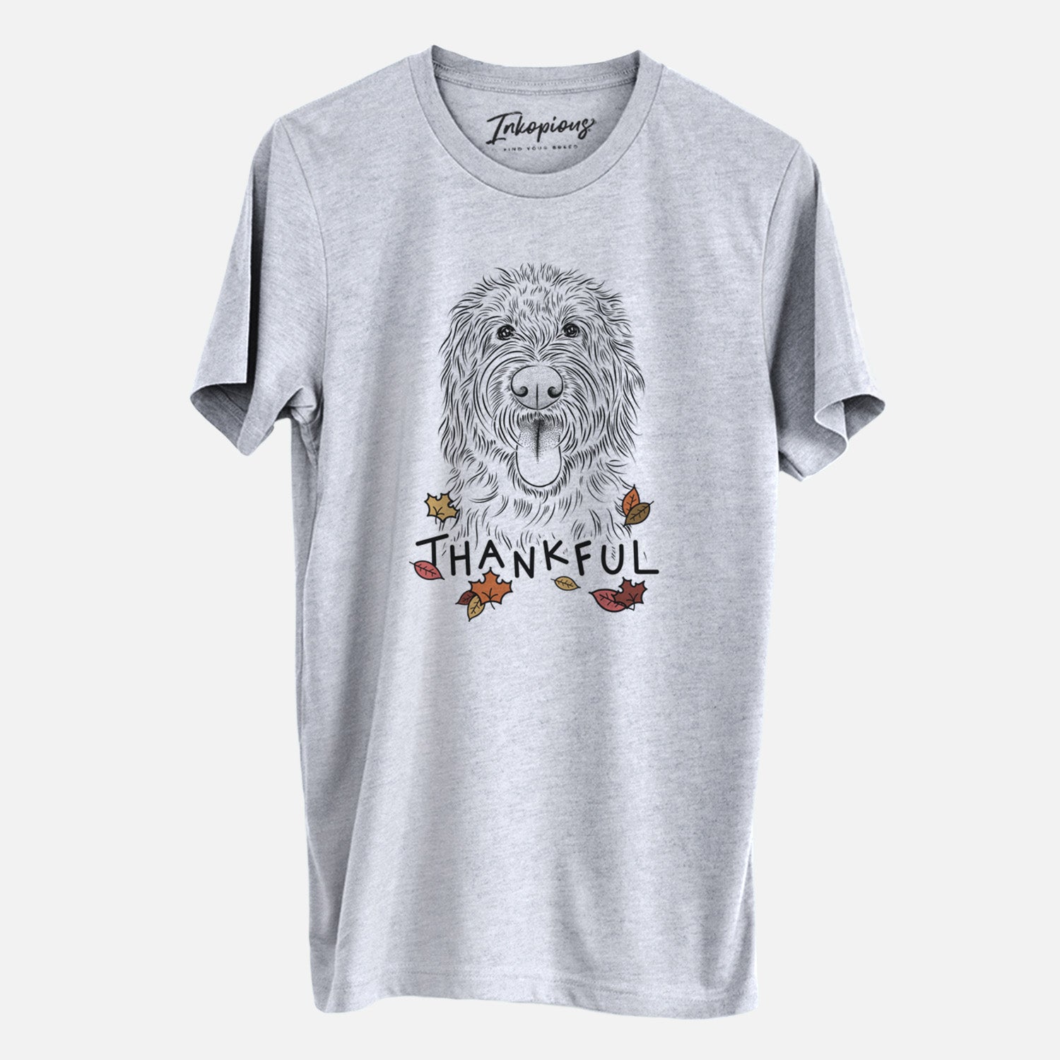 Hand-drawn sketch of Bennett the Doodle with 'Thankful' lettering and autumn leaves on a Grey Unisex crewneck