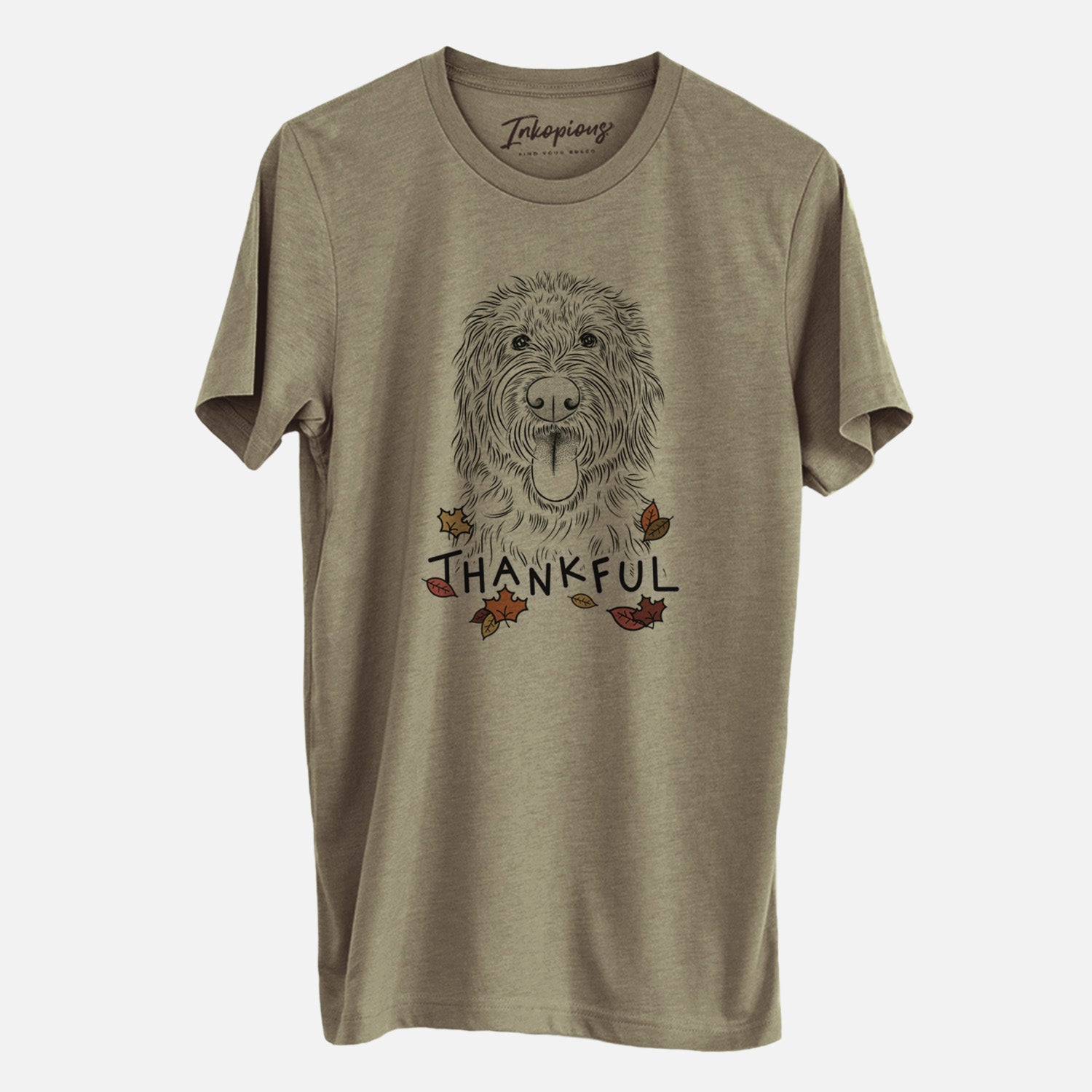 Hand-drawn sketch of Bennett the Doodle with 'Thankful' lettering and autumn leaves on an Olive Unisex crewneck