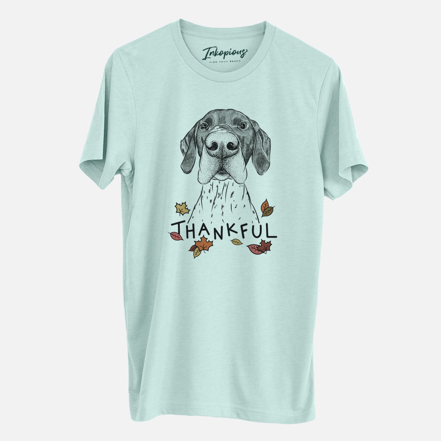 Hand-drawn sketch of Booze the German Shorthaired Pointer with 'Thankful' lettering and autumn leaves on a Heather Sage Unisex crewneck