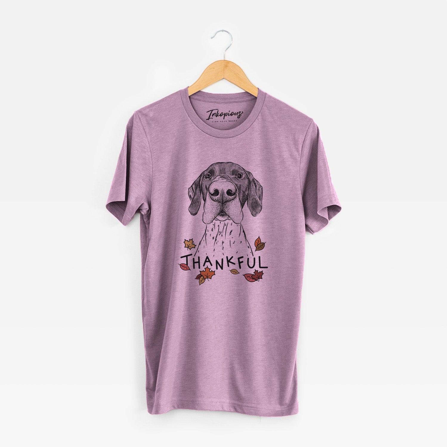 Hand-drawn sketch of Booze the German Shorthaired Pointer with 'Thankful' lettering and autumn leaves on an Orchid Unisex crewneck