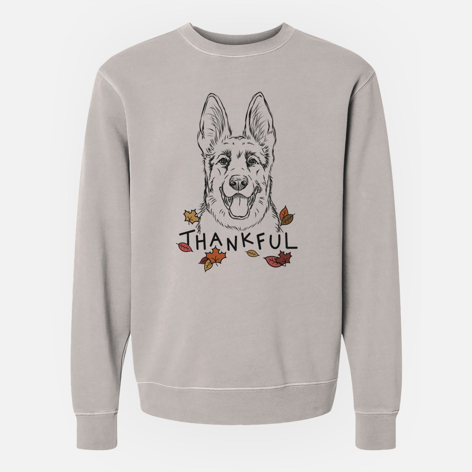 Hand-drawn sketch of Brutus the German Shepherd with 'Thankful' lettering and autumn leaves on a Cement Unisex pigment dyed crew sweatshirt
