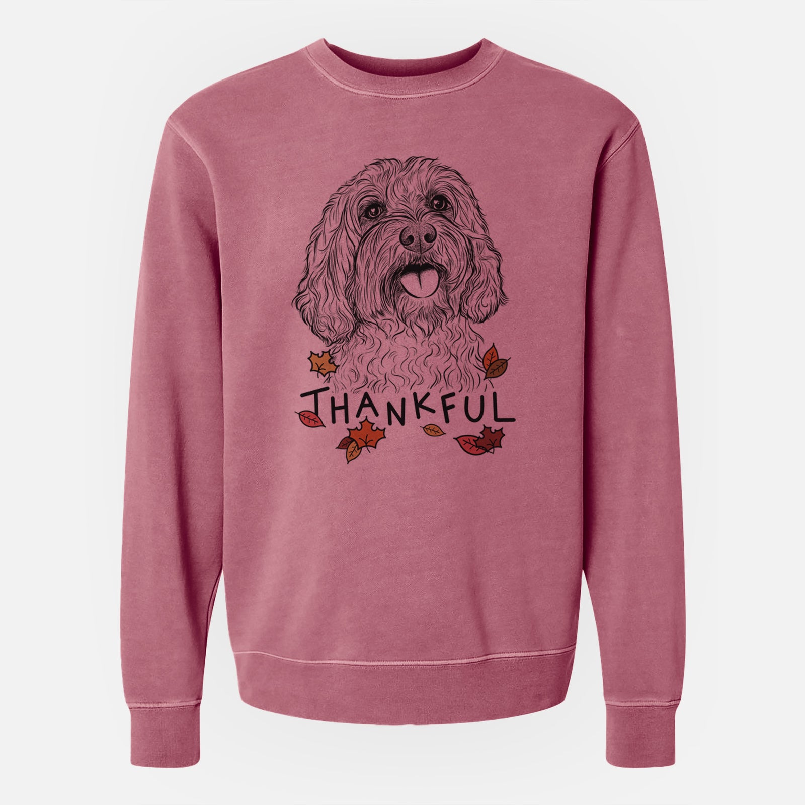 Hand-drawn sketch of Cali the Cavapoo with 'Thankful' lettering and autumn leaves on a Maroon Unisex pigment dyed crew sweatshirt