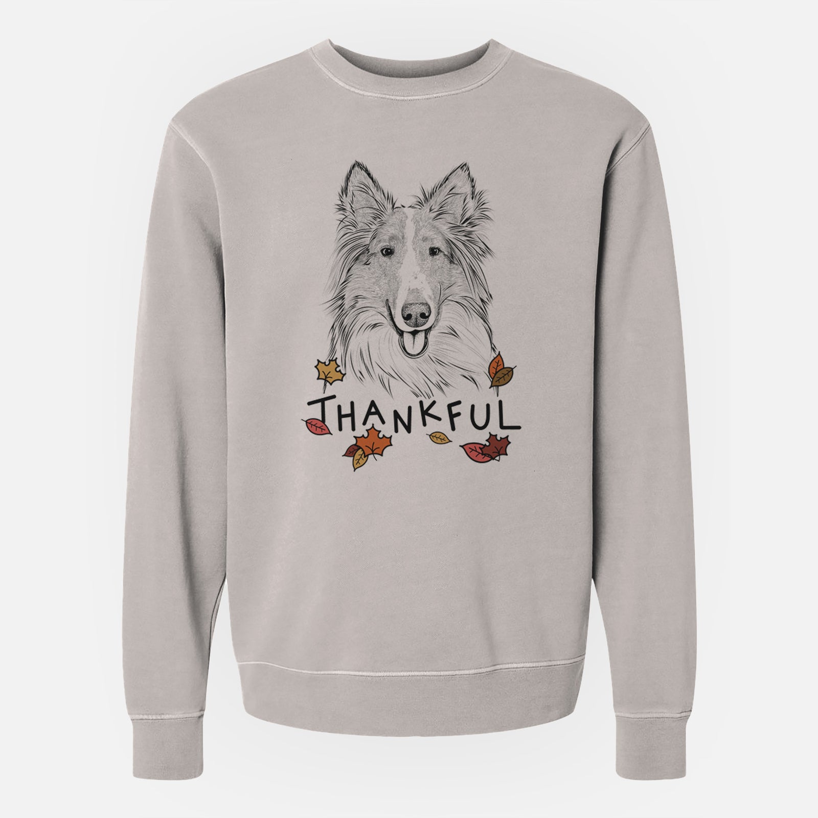 Hand-drawn sketch of Conrad the Rough Collie with 'Thankful' lettering and autumn leaves on a Cement Unisex pigment dyed crew sweatshirt
