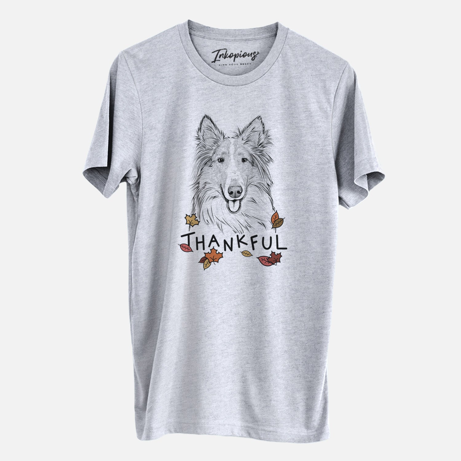 Hand-drawn sketch of Conrad the Rough Collie with 'Thankful' lettering and autumn leaves on a Grey Unisex crewneck