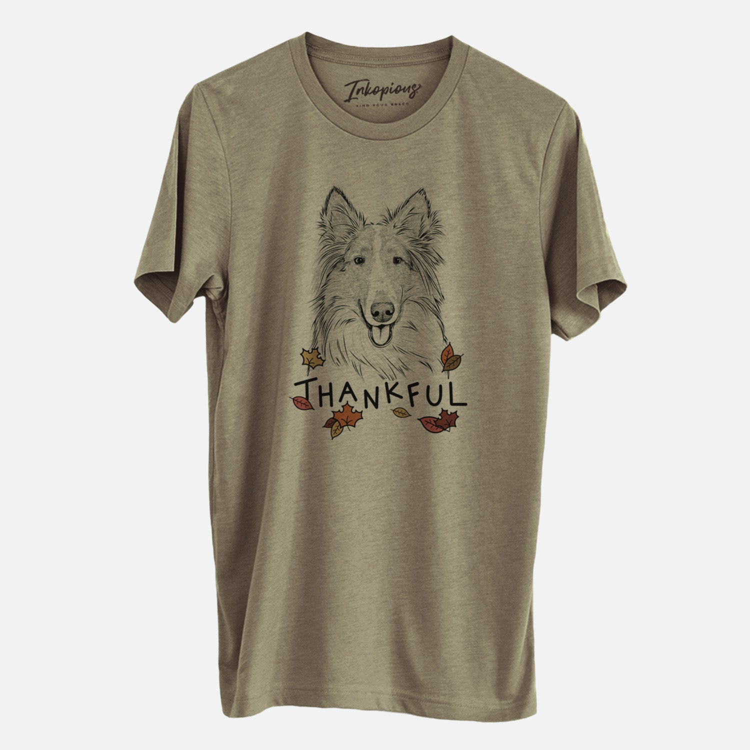 Hand-drawn sketch of Conrad the Rough Collie with 'Thankful' lettering and autumn leaves on an Olive Unisex crewneck