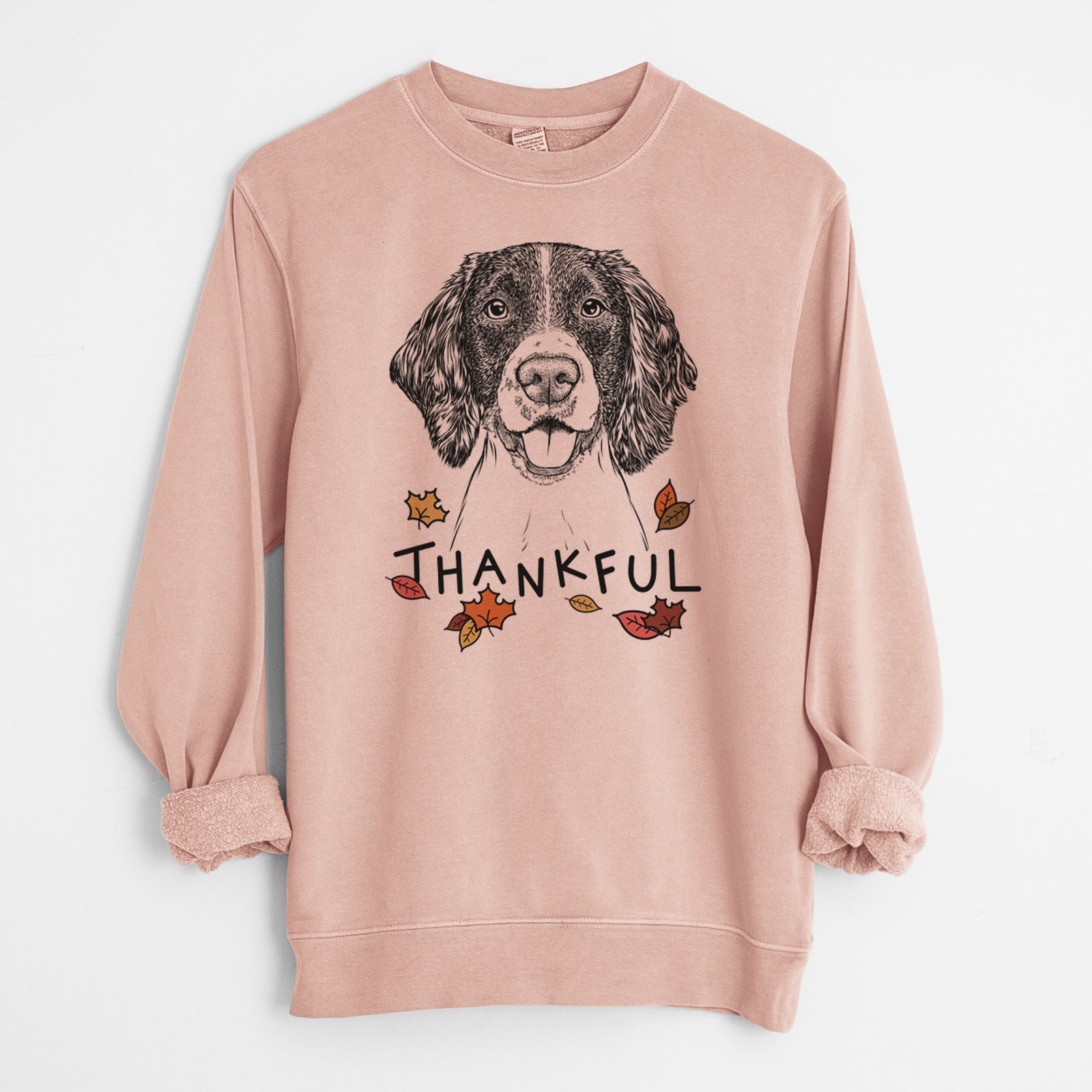 Hand-drawn sketch of Ever the English Springer Spaniel with 'Thankful' lettering and autumn leaves on a Dusty Pink Unisex pigment dyed crew sweatshirt