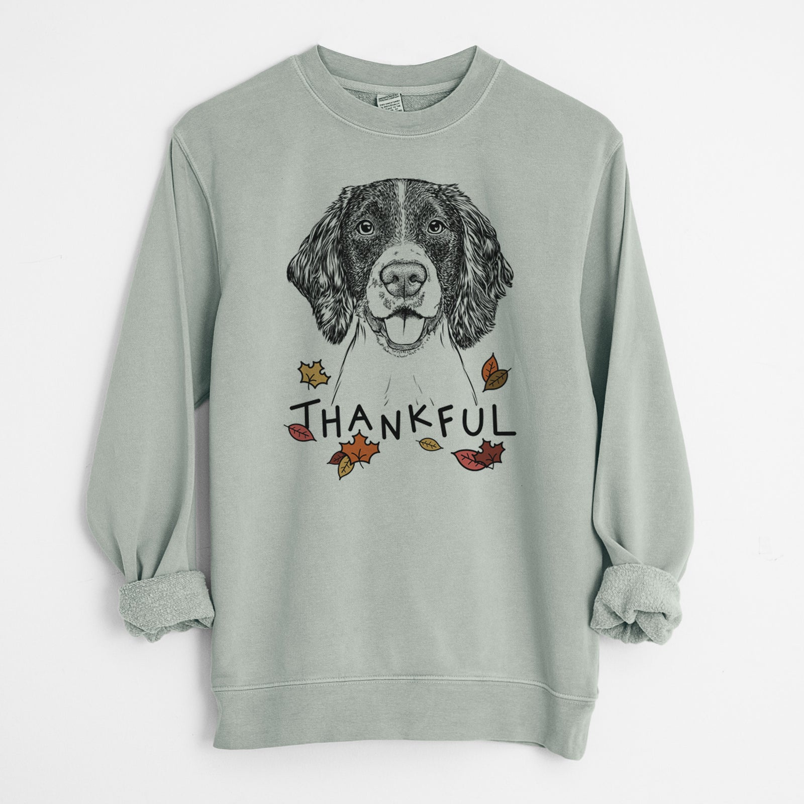 Hand-drawn sketch of Ever the English Springer Spaniel with 'Thankful' lettering and autumn leaves on a Sage Unisex pigment dyed crew sweatshirt