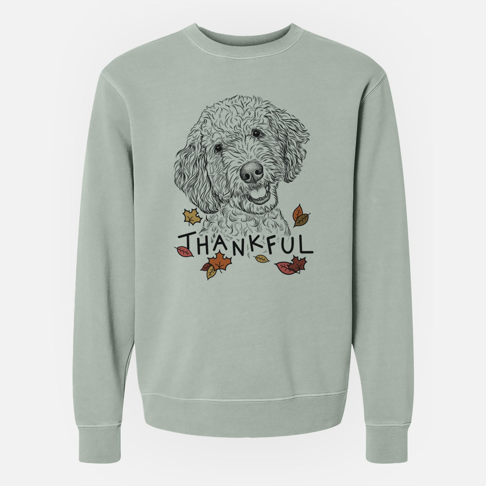 Hand-drawn sketch of Gizmo the Goldendoodle with 'Thankful' lettering and autumn leaves on a Sage Unisex pigment dyed crew sweatshirt