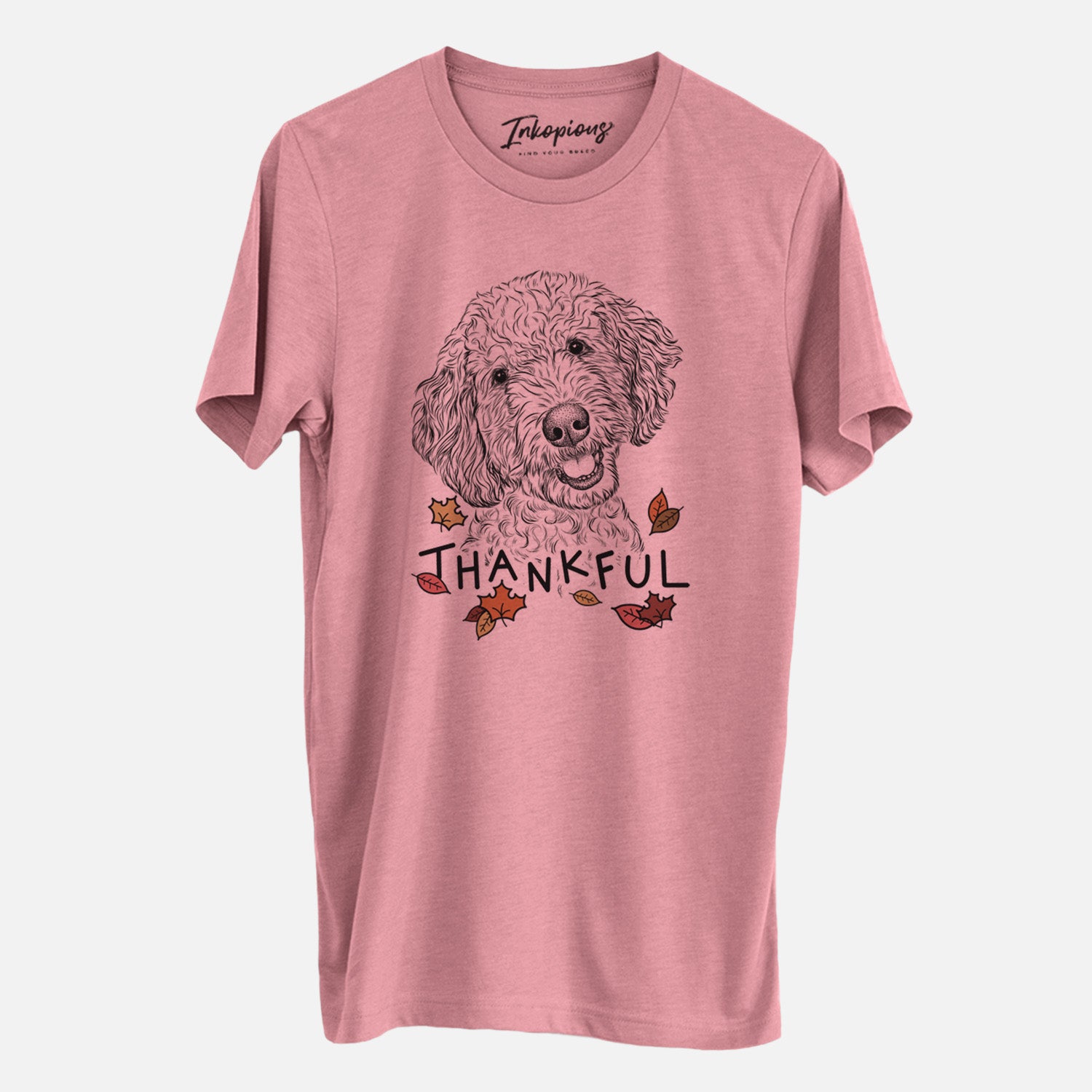 Hand-drawn sketch of Gizmo the Goldendoodle with 'Thankful' lettering and autumn leaves on a Mauve Unisex crewneck