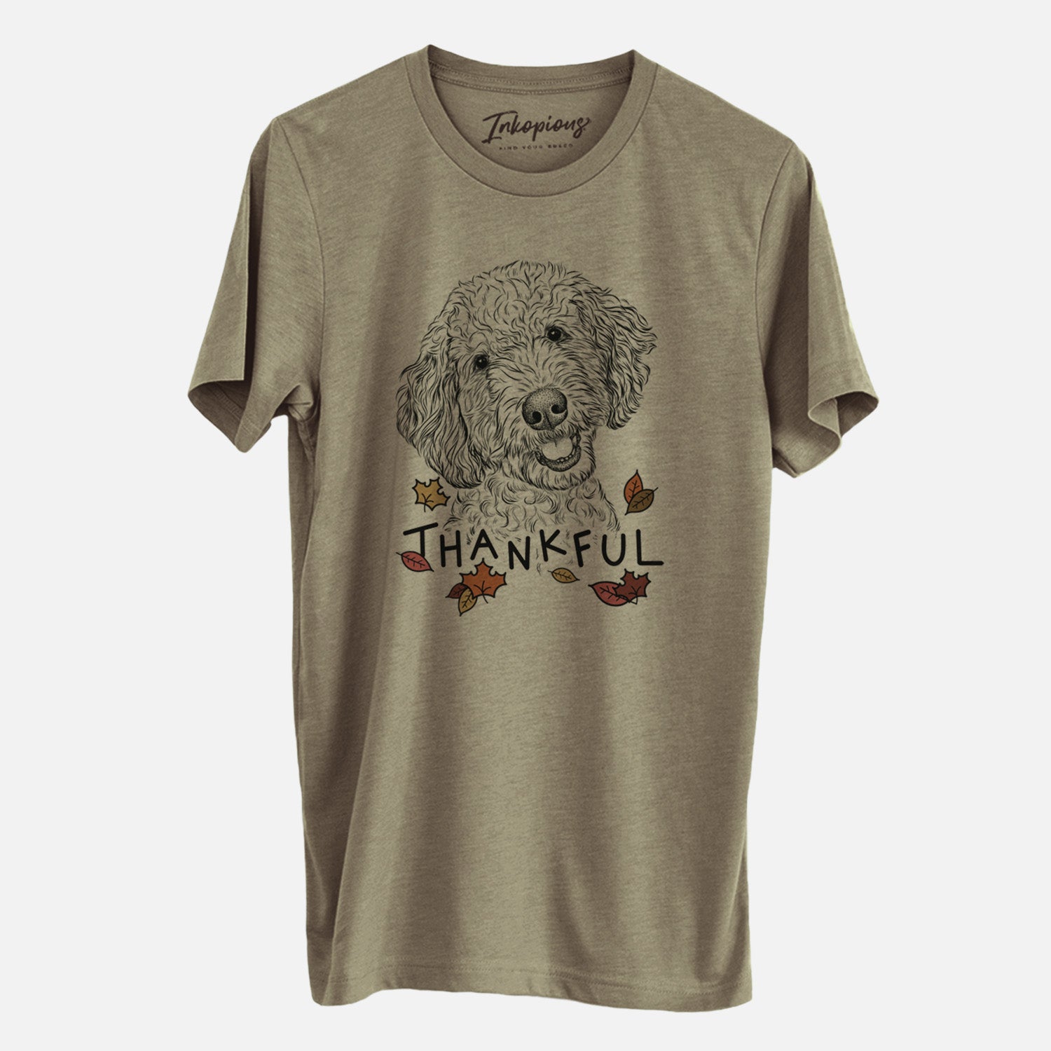 Hand-drawn sketch of Gizmo the Goldendoodle with 'Thankful' lettering and autumn leaves on an Olive Unisex crewneck