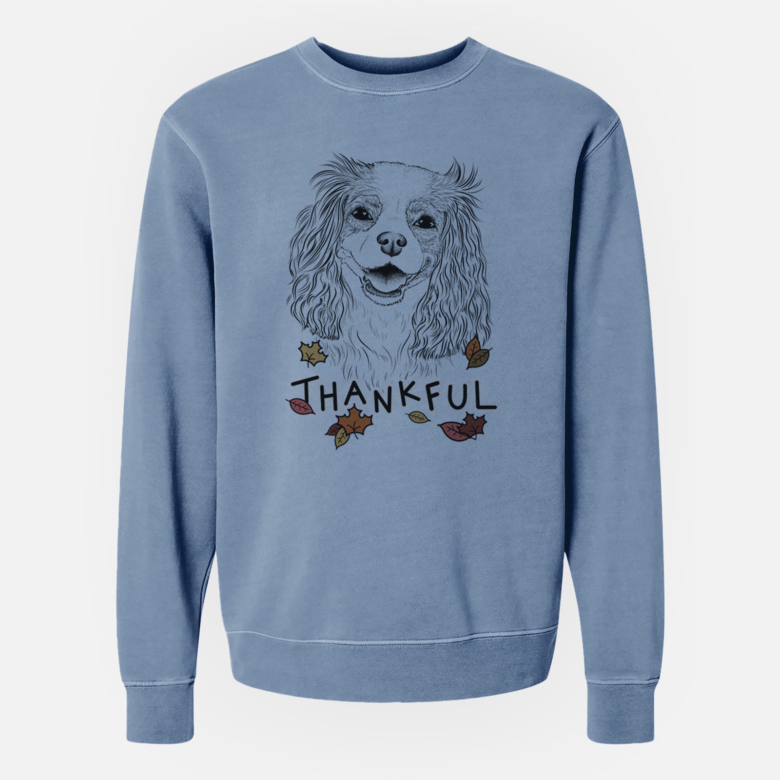 Hand-drawn sketch of Halley Comet the Cavalier King Charles Spaniel with 'Thankful' lettering and autumn leaves on a Slate Blue Unisex pigment dyed crew sweatshirt