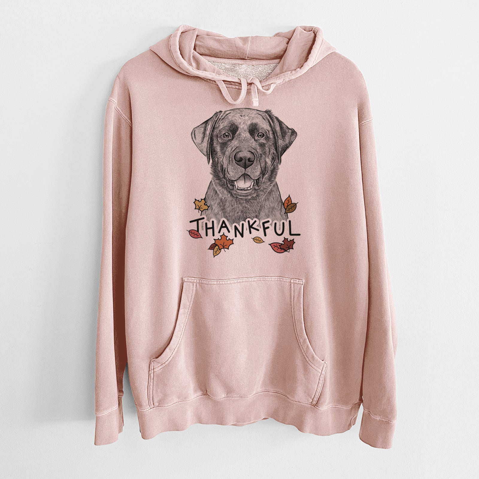 Hand-drawn sketch of Heath the Black Lab with 'Thankful' lettering and autumn leaves on a Dusty Pink Unisex pigment dyed hoodie