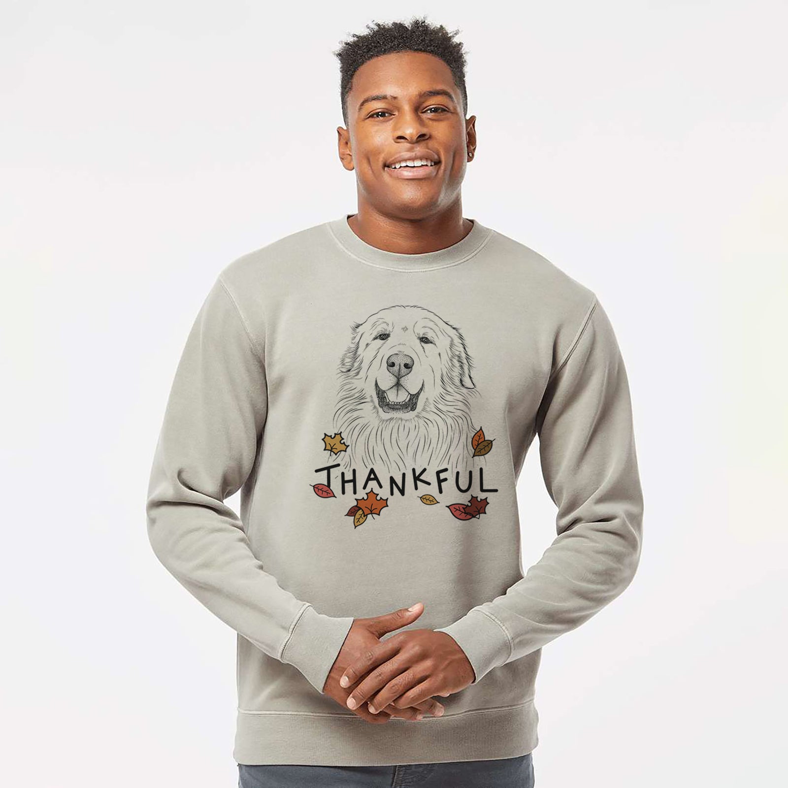 Hand-drawn sketch of Horton the Great Pyrenees with 'Thankful' lettering and autumn leaves on a Cement Unisex pigment dyed crew sweatshirt