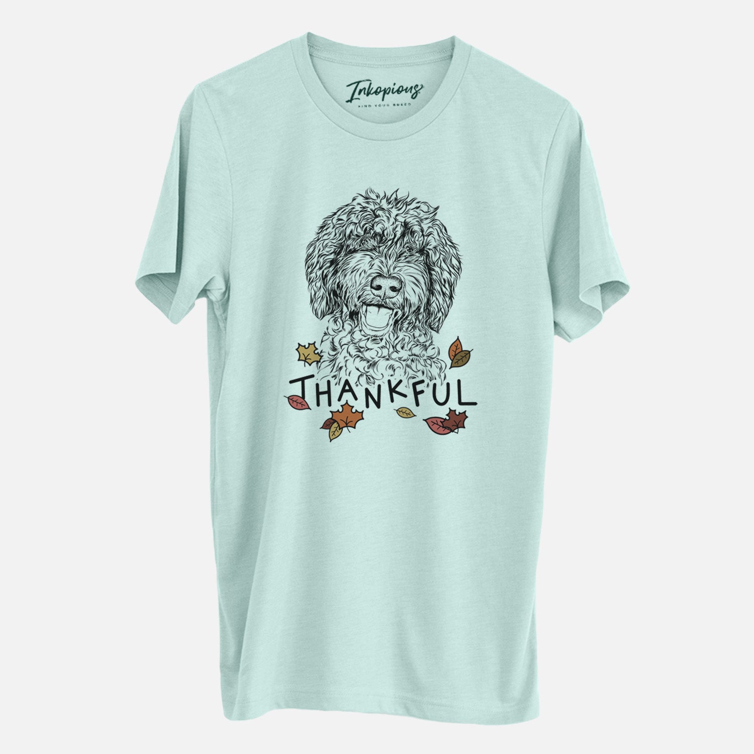 Hand-drawn sketch of Jack the Chocolate Labradoodle with 'Thankful' lettering and autumn leaves on a Heather Sage Unisex crewneck