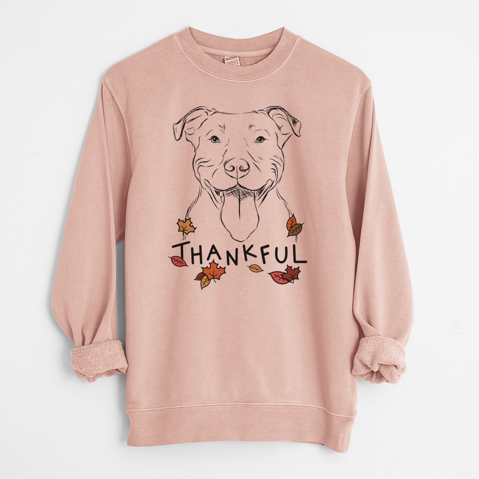 Hand-drawn sketch of Major the Pitbull with 'Thankful' lettering and autumn leaves on a Dusty Pink Unisex pigment dyed crew sweatshirt