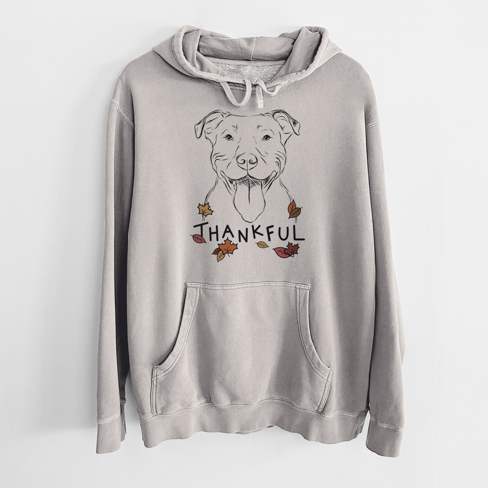 Hand-drawn sketch of Major the Pitbull with 'Thankful' lettering and autumn leaves on a Cement Unisex pigment dyed hoodie