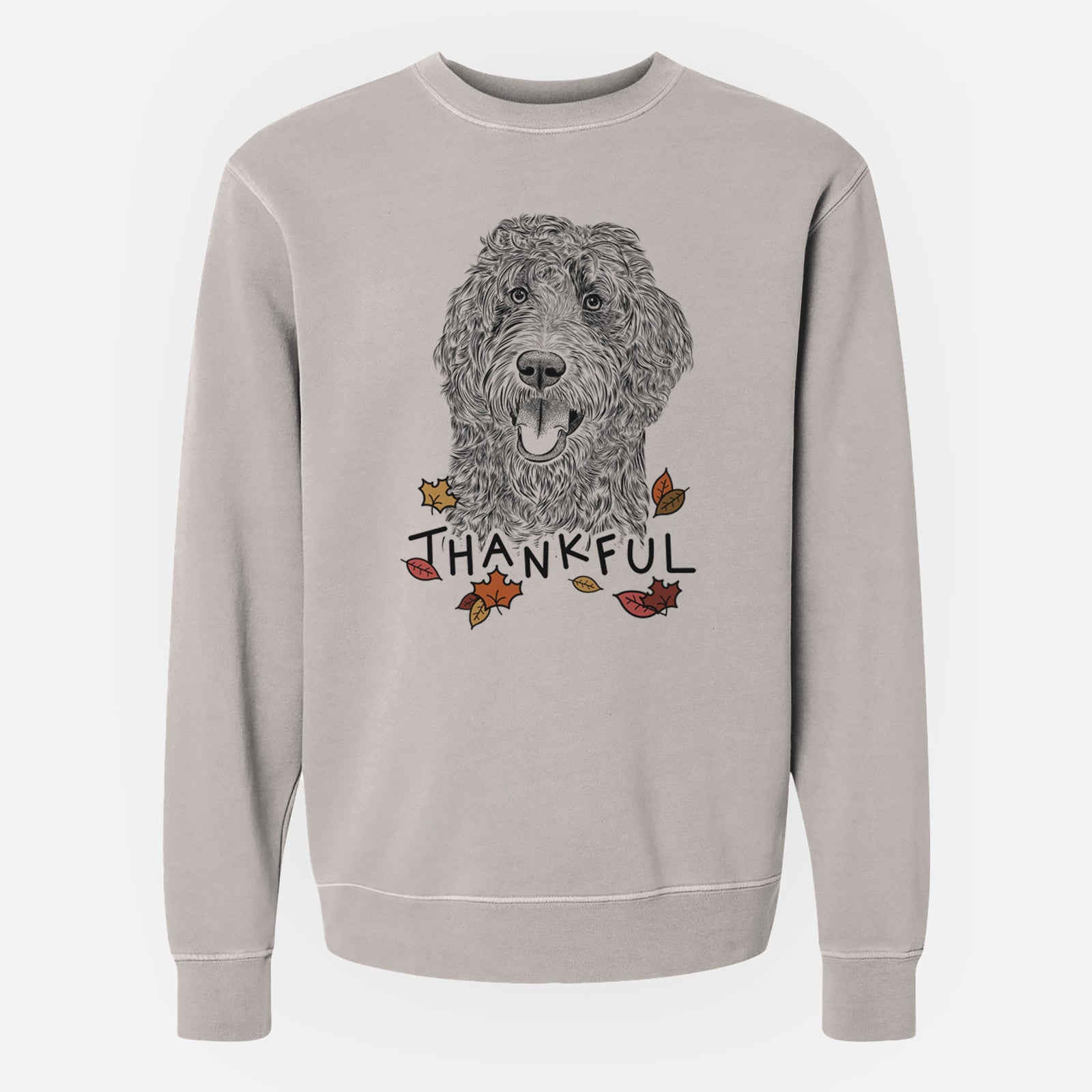 Hand-drawn sketch of Murr Dog the Labradoodle with 'Thankful' lettering and autumn leaves on a Cement Unisex pigment dyed crew sweatshirt