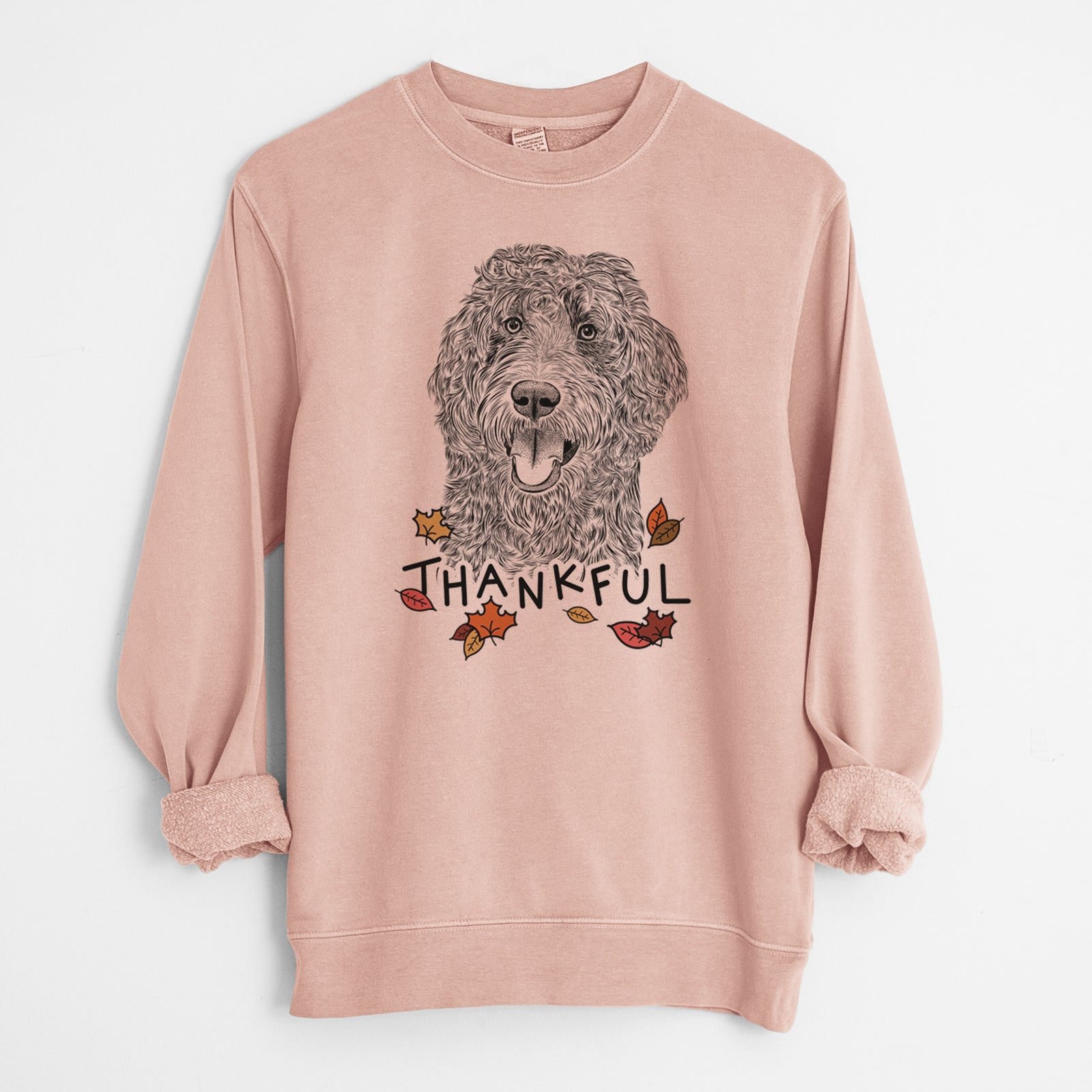 Hand-drawn sketch of Murr Dog the Labradoodle with 'Thankful' lettering and autumn leaves on a Dusty Pink Unisex pigment dyed crew sweatshirt