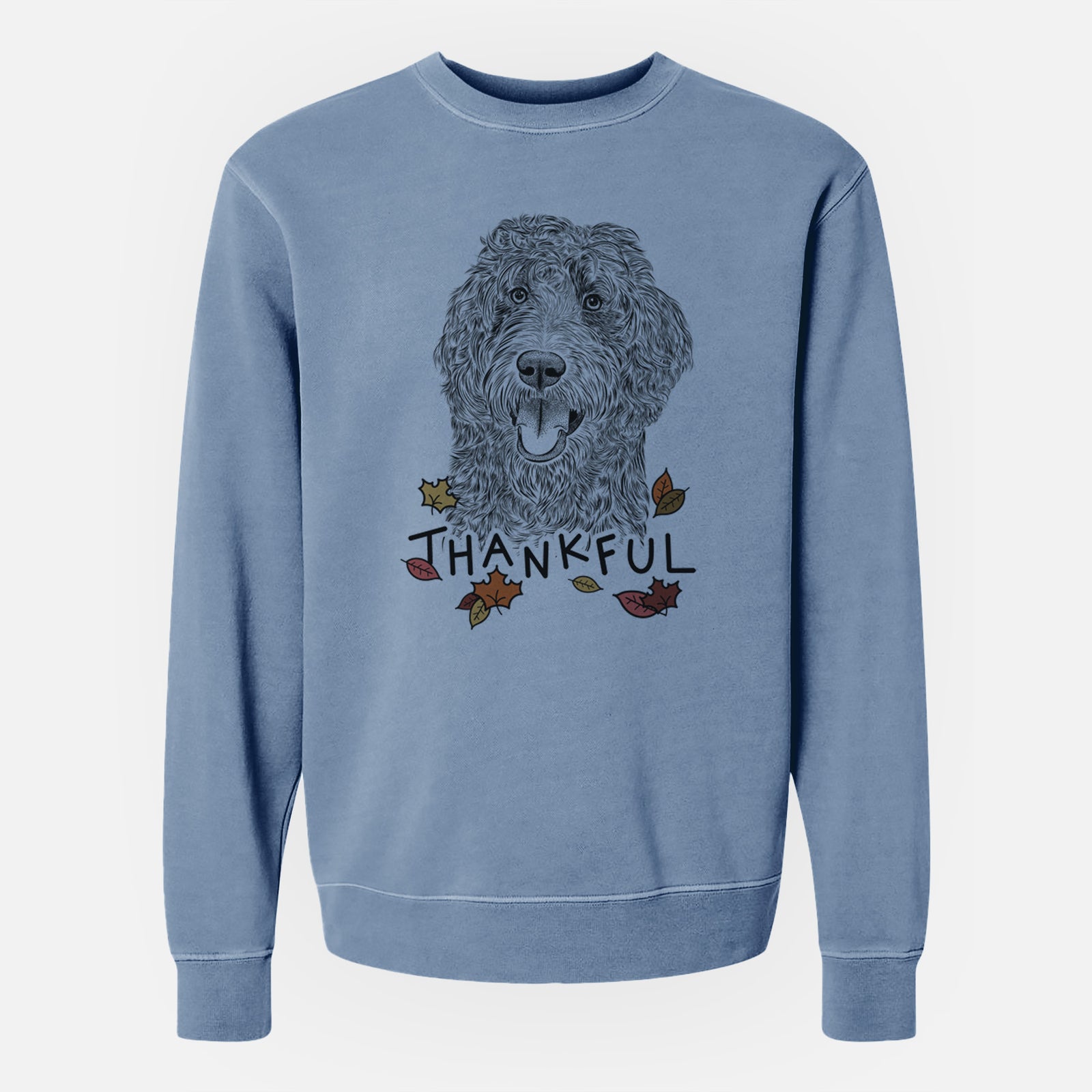 Hand-drawn sketch of Murr Dog the Labradoodle with 'Thankful' lettering and autumn leaves on a Slate Blue Unisex pigment dyed crew sweatshirt