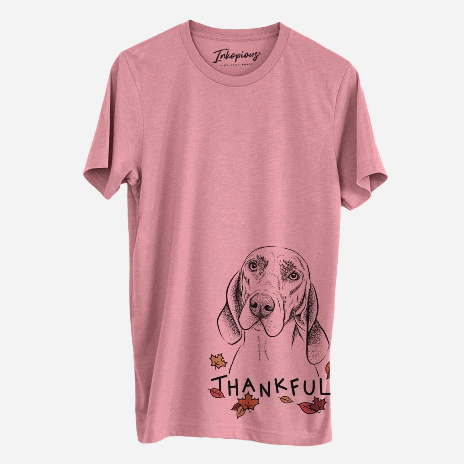 Hand-drawn sketch of Norman the Plott Hound with 'Thankful' lettering and autumn leaves on a Mauve Unisex crewneck, worn by a man