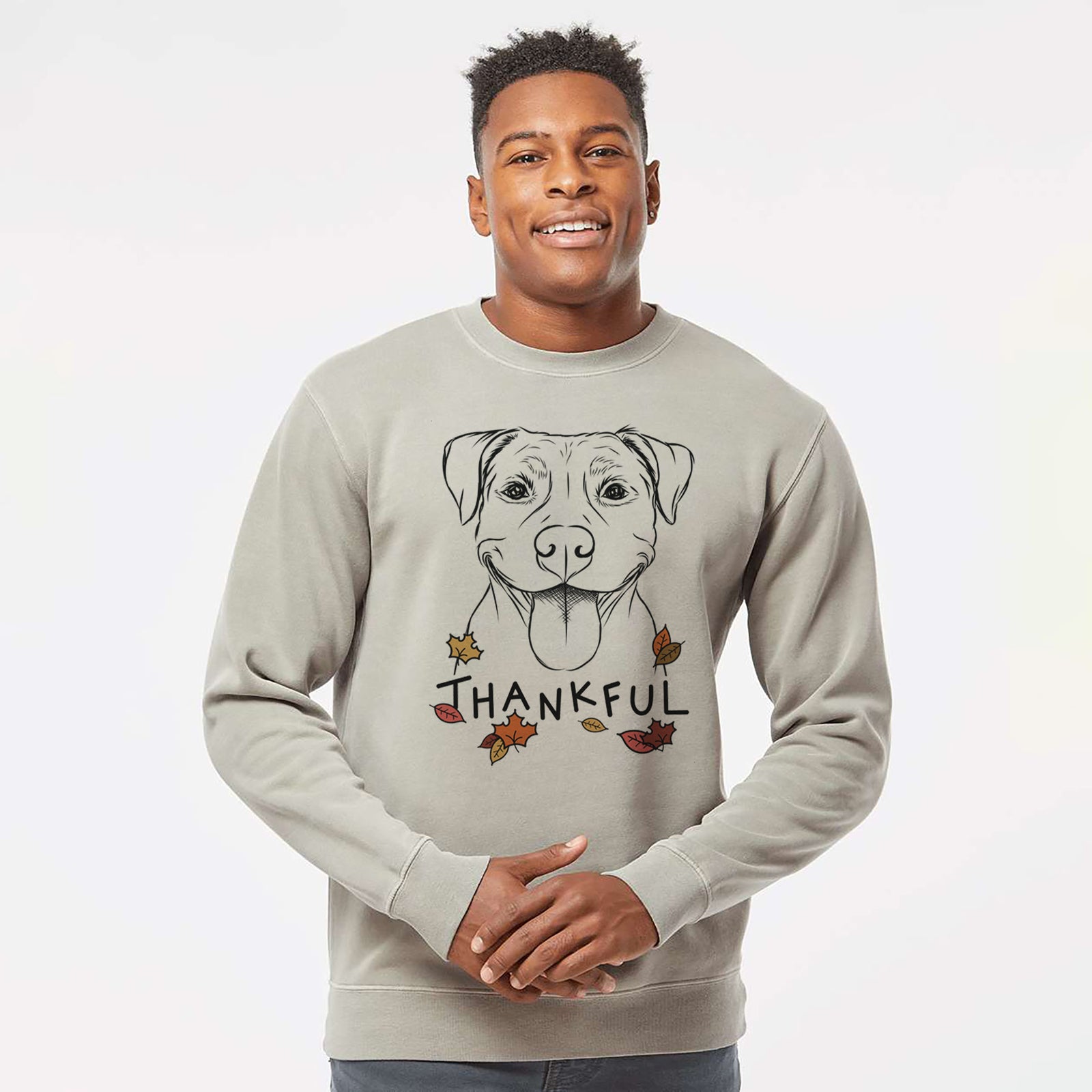 Hand-drawn sketch of Parker the Pitbull with 'Thankful' lettering and autumn leaves on a Cement Unisex pigment dyed crew sweatshirt