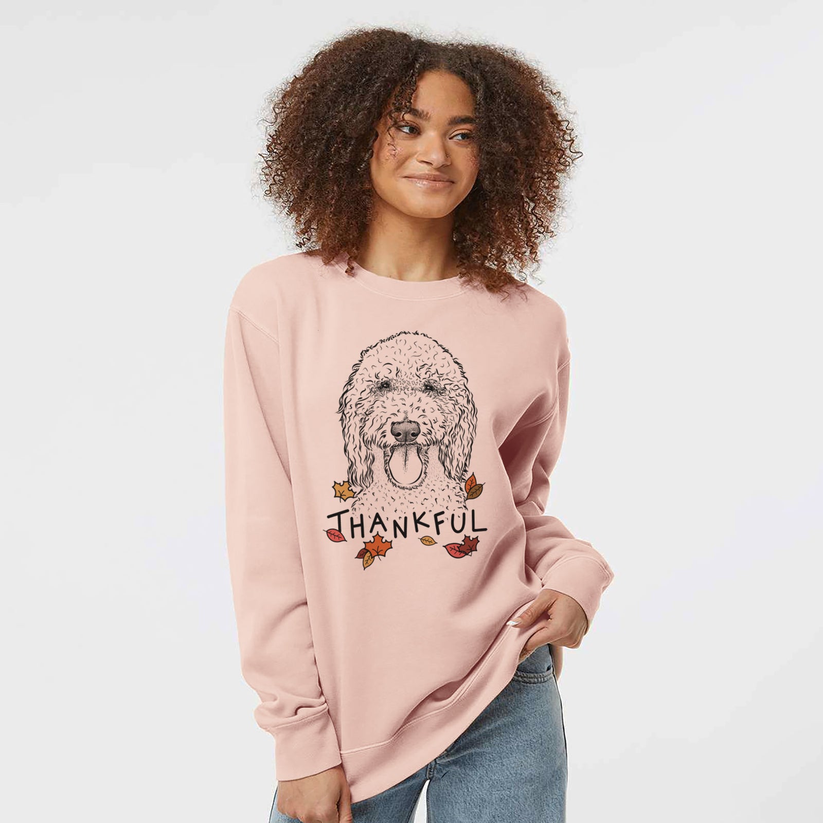 Hand-drawn sketch of Pavlov the Goldendoodle with 'Thankful' lettering and autumn leaves on a Dusty Pink Unisex pigment dyed crew sweatshirt