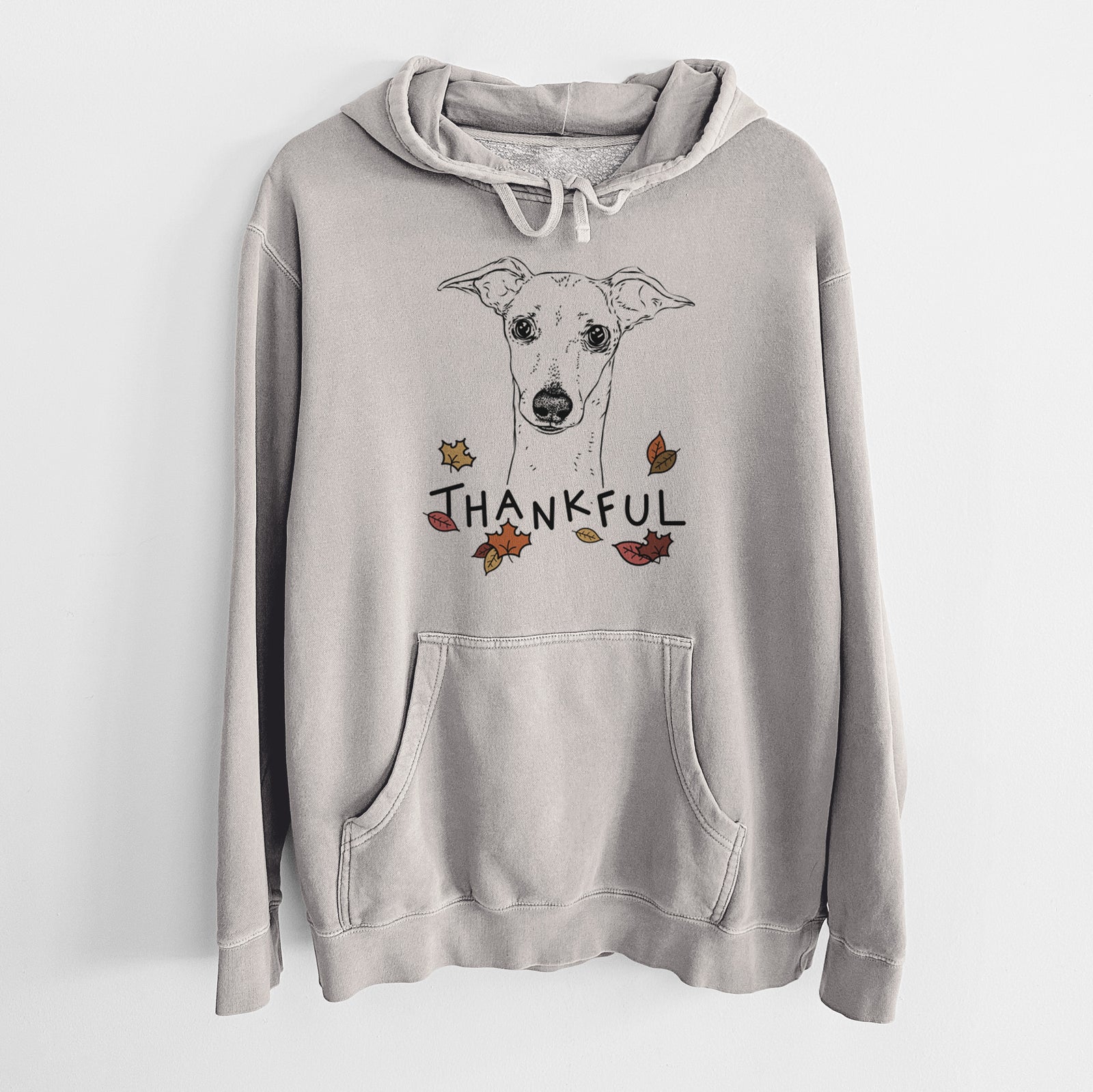 Hand-drawn sketch of Pip the Italian Greyhound with 'Thankful' lettering and autumn leaves on a Cement Unisex pigment dyed hoodie