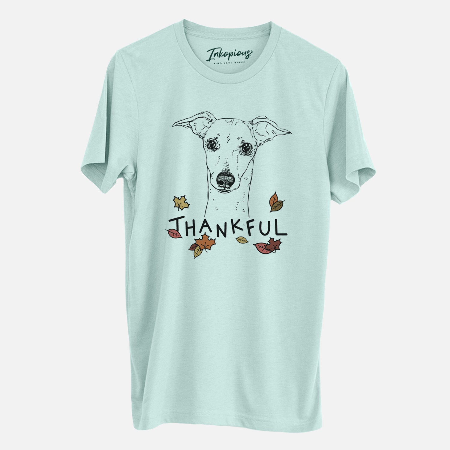 Hand-drawn sketch of Pip the Italian Greyhound with 'Thankful' lettering and autumn leaves on a Heather Sage Unisex crewneck