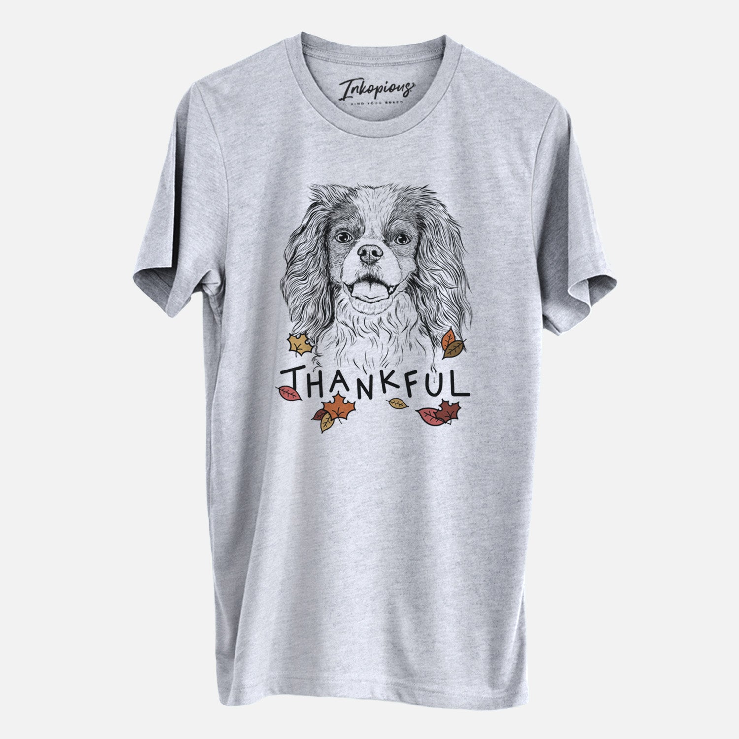 Hand-drawn sketch of Poppy the Cavalier King Charles Spaniel with 'Thankful' lettering and autumn leaves on a Grey Unisex crewneck
