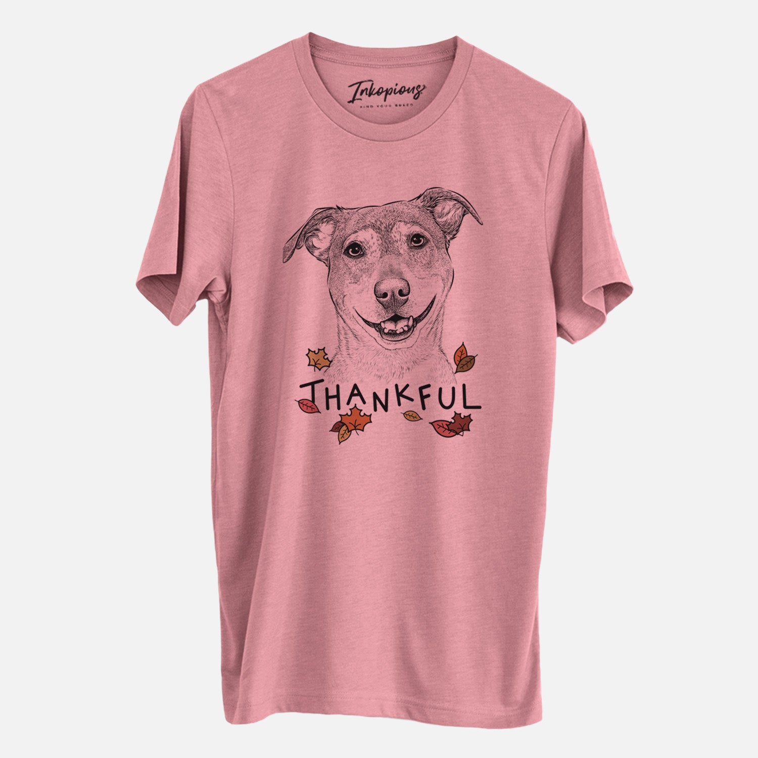 Hand-drawn sketch of Reese the Mountain Cur with 'Thankful' lettering and autumn leaves on a Mauve Unisex crewneck, worn by a man