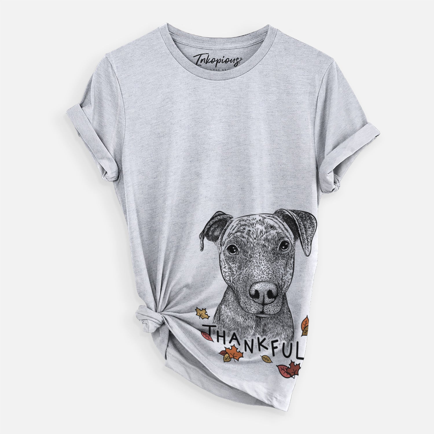 Hand-drawn sketch of Reeses the Pitbull with 'Thankful' lettering and autumn leaves on a Grey Unisex crewneck, worn by a woman