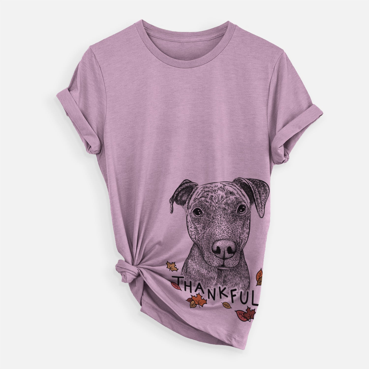 Hand-drawn sketch of Reeses the Pitbull with 'Thankful' lettering and autumn leaves on an Orchid Unisex crewneck, worn by a woman