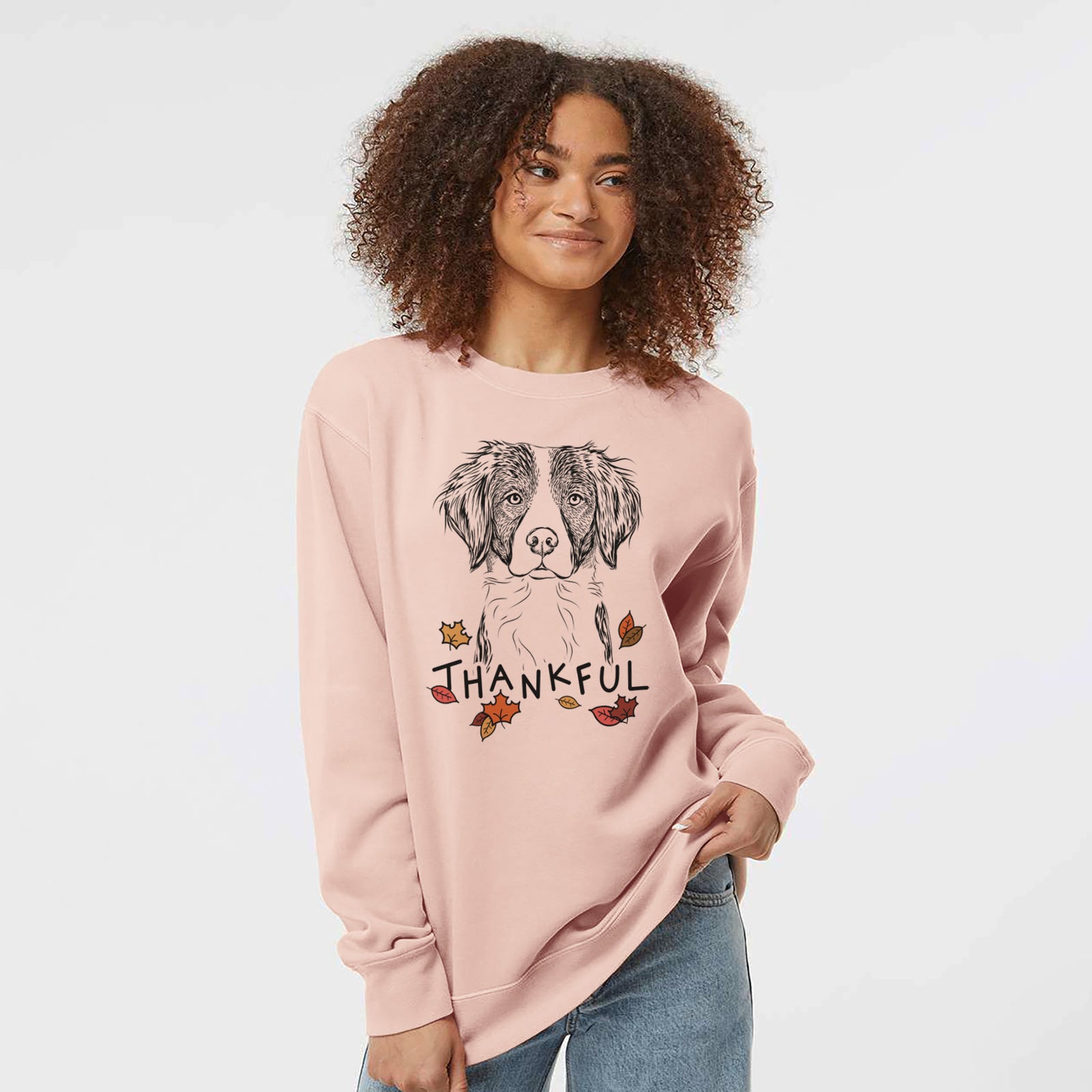 Hand-drawn sketch of Remi the Brittany with 'Thankful' lettering and autumn leaves on a Dusty Pink Unisex pigment dyed crew sweatshirt