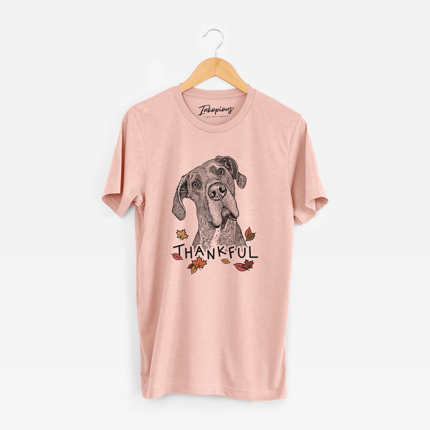 Hand-drawn sketch of River the Great Dane with 'Thankful' lettering and autumn leaves on a Peach Unisex crewneck