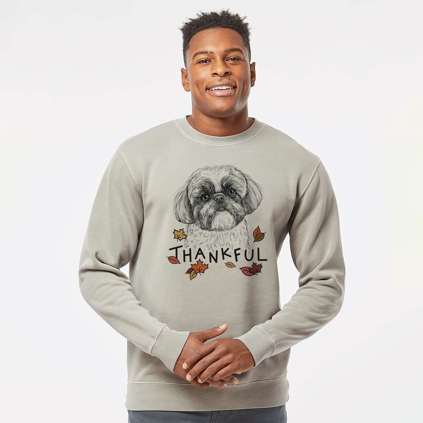 Hand-drawn sketch of Simon the Shih Tzu with 'Thankful' lettering and autumn leaves on a Cement Unisex pigment dyed crew sweatshirt