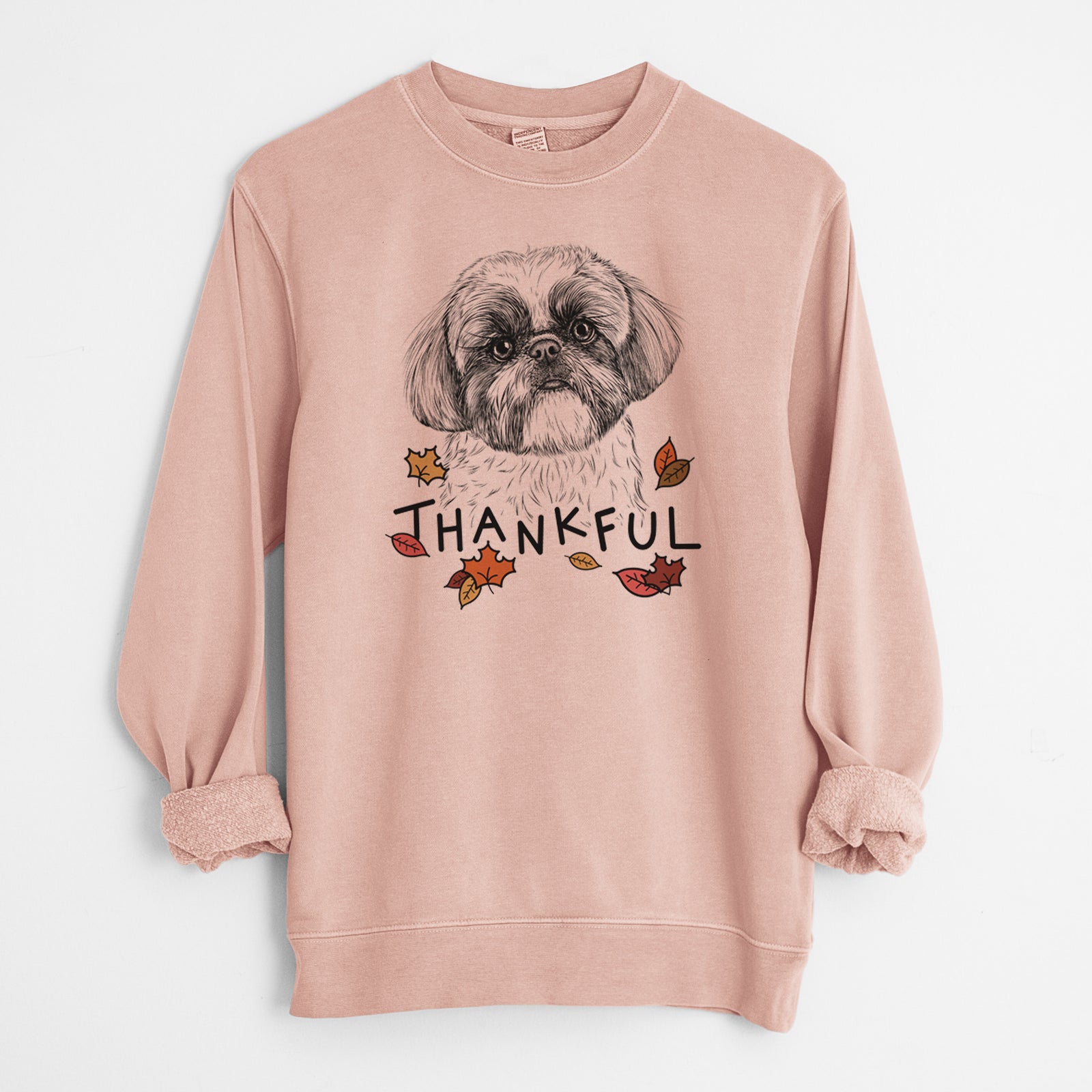 Hand-drawn sketch of Simon the Shih Tzu with 'Thankful' lettering and autumn leaves on a Dusty Pink Unisex pigment dyed crew sweatshirt