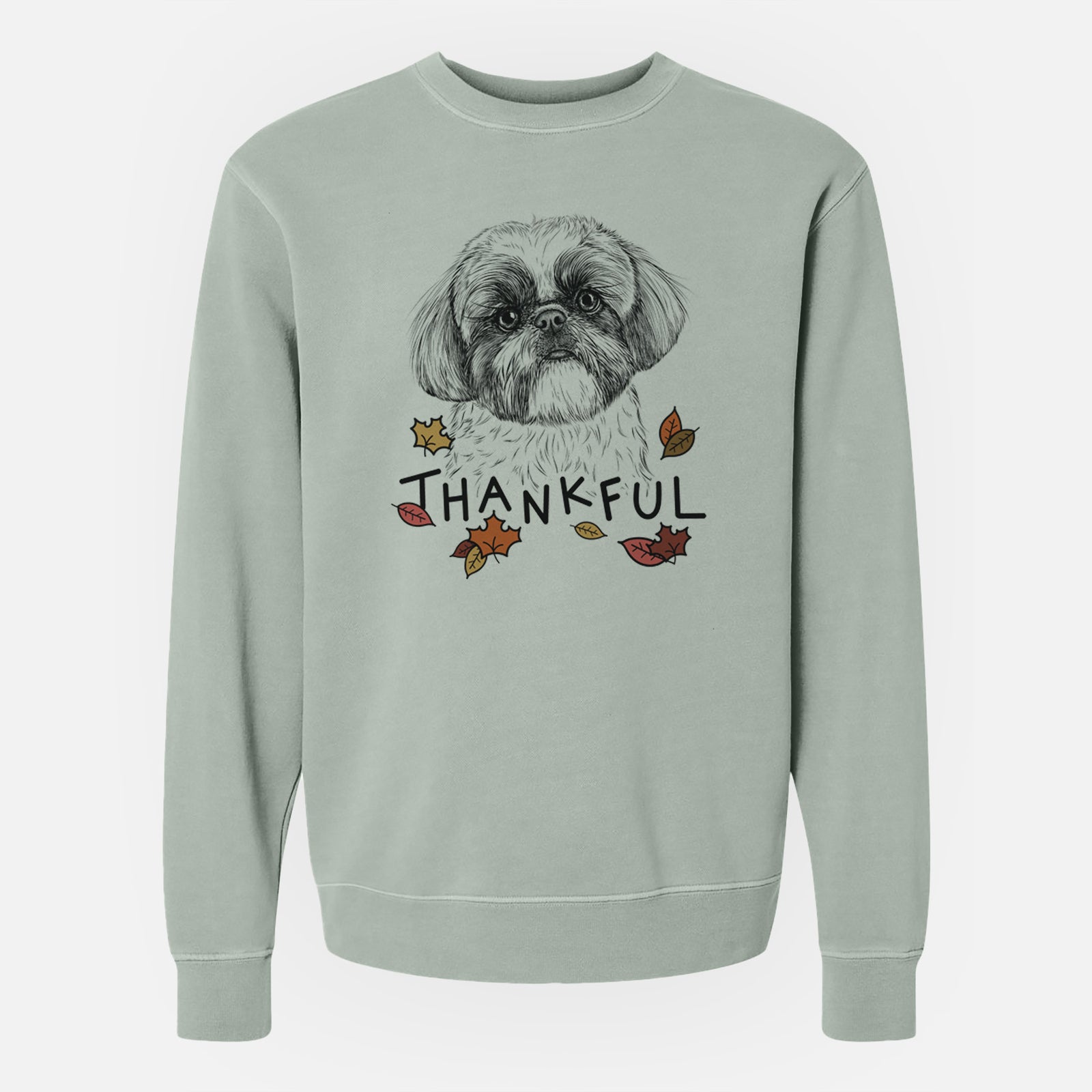 Hand-drawn sketch of Simon the Shih Tzu with 'Thankful' lettering and autumn leaves on a Sage Unisex pigment dyed crew sweatshirt