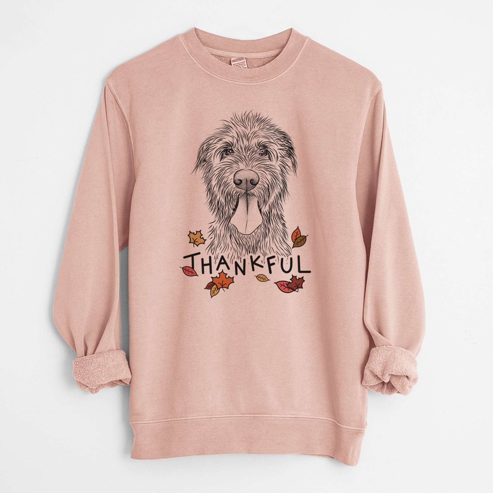 Hand-drawn sketch of Sullivan the Irish Wolfhound with 'Thankful' lettering and autumn leaves on a Dusty Pink Unisex pigment dyed crew sweatshirt