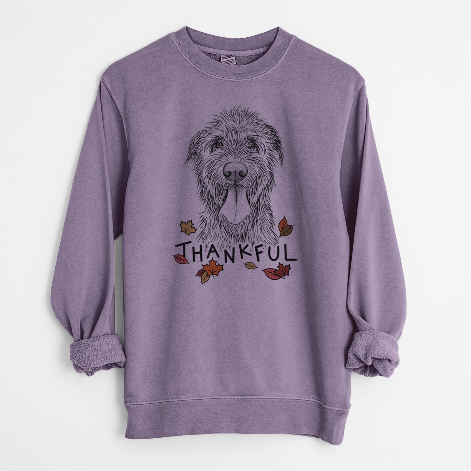 Hand-drawn sketch of Sullivan the Irish Wolfhound with 'Thankful' lettering and autumn leaves on a Plum Unisex pigment dyed crew sweatshirt