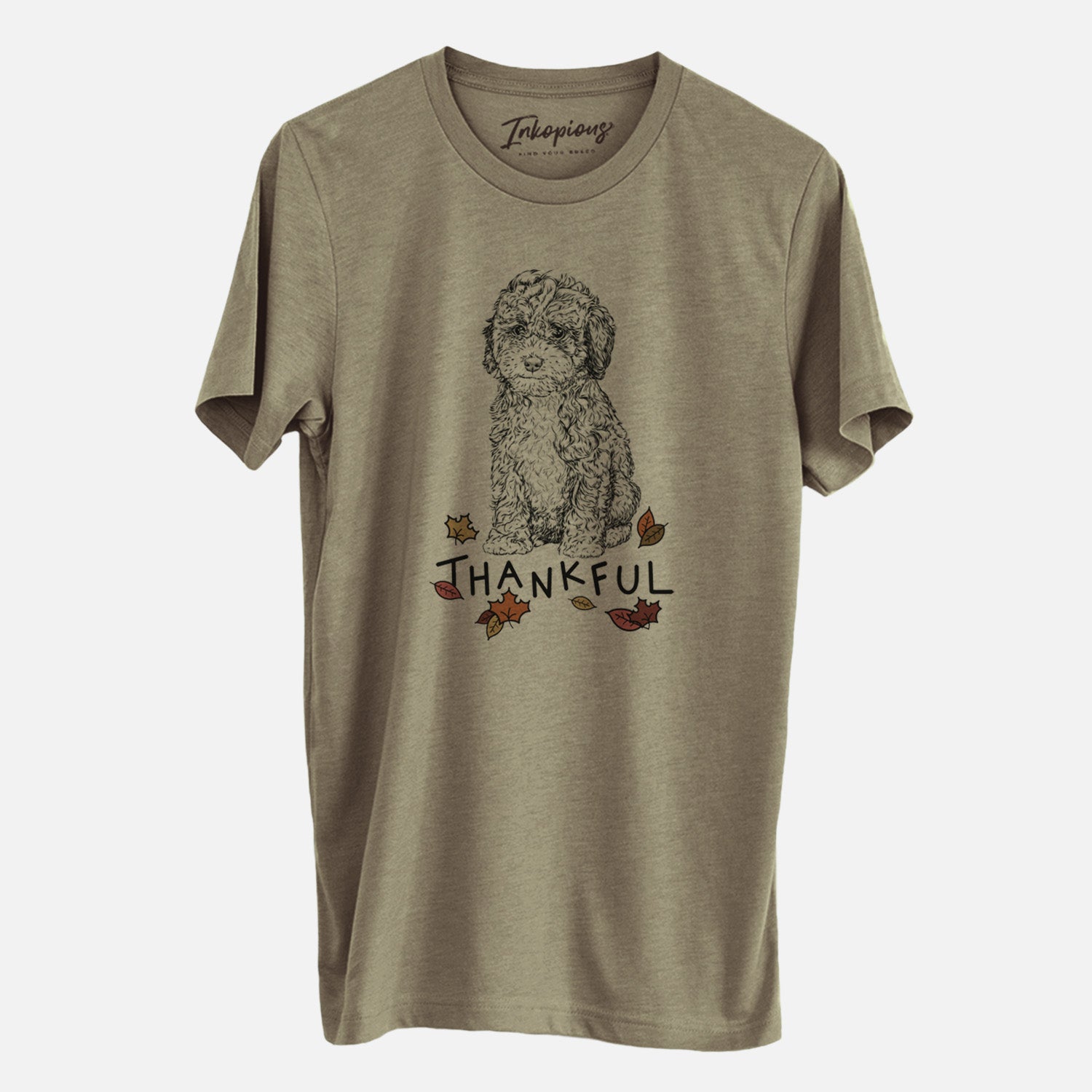 Hand-drawn sketch of Sweet Tea the Mini Doodle with 'Thankful' lettering and autumn leaves on an Olive Unisex crewneck