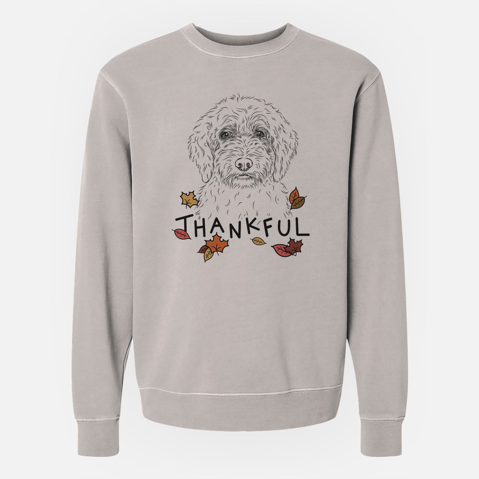 Hand-drawn sketch of Teddy the Labradoodle with 'Thankful' lettering and autumn leaves on a Cement Unisex pigment dyed crew sweatshirt