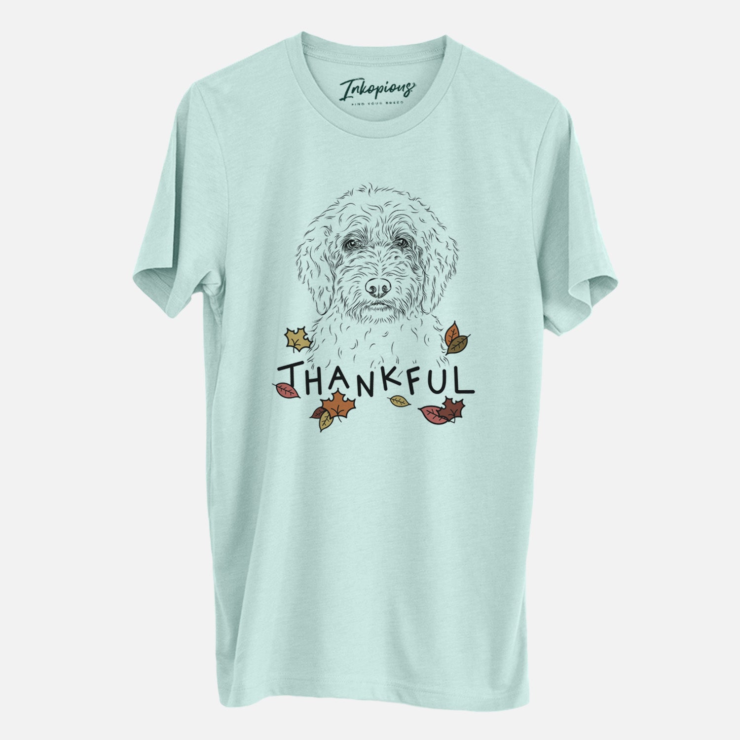 Hand-drawn sketch of Teddy the Labradoodle with 'Thankful' lettering and autumn leaves on a Heather Sage Unisex crewneck