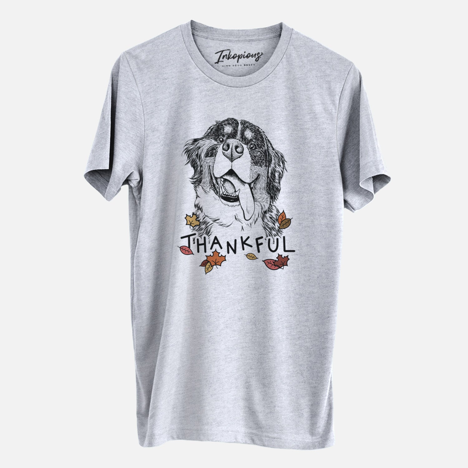 Hand-drawn sketch of Theo the Bernese Mountain Dog with 'Thankful' lettering and autumn leaves on a Grey Unisex crewneck