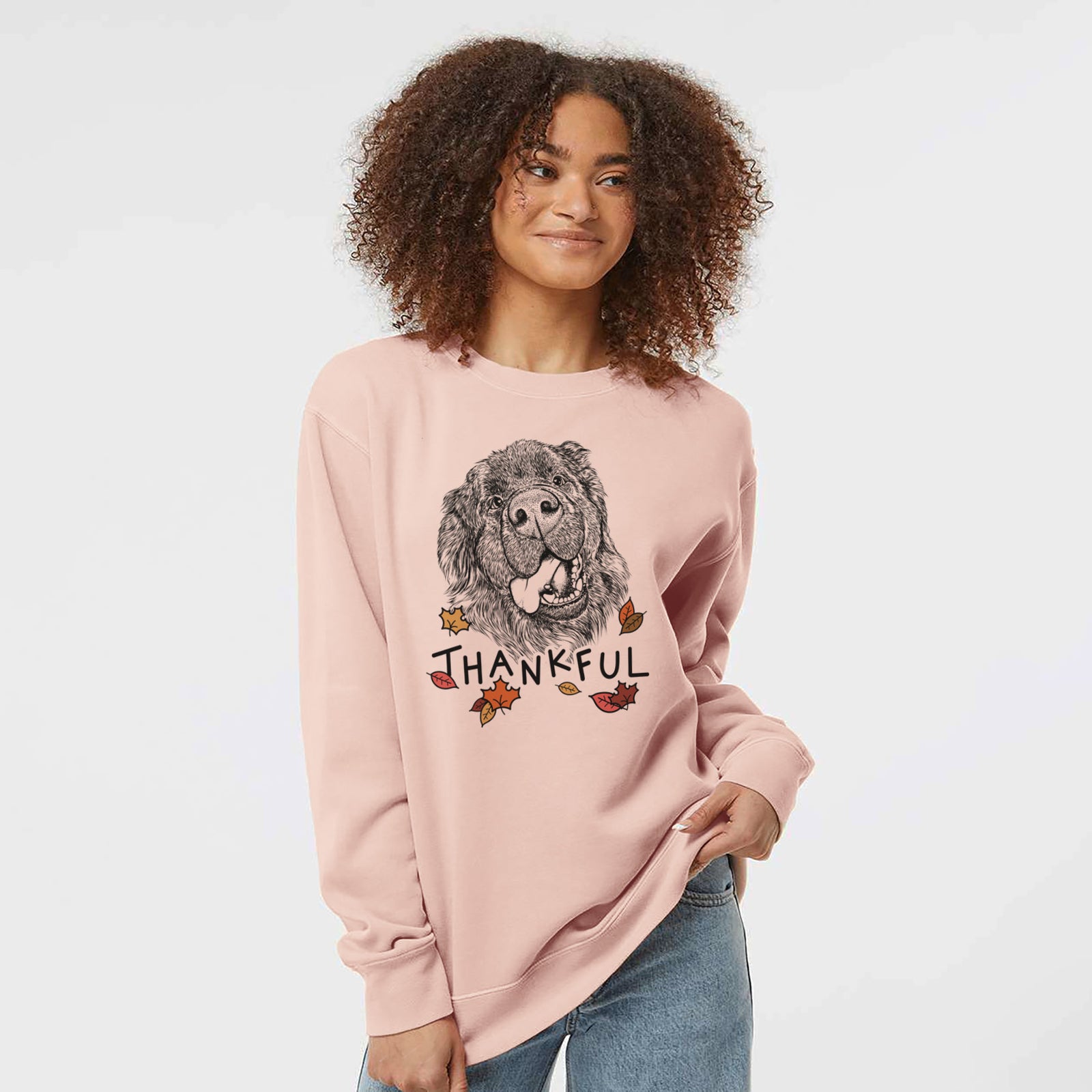 Hand-drawn sketch of Tuna the Newfoundland with 'Thankful' lettering and autumn leaves on a Dusty Pink Unisex pigment dyed crew sweatshirt
