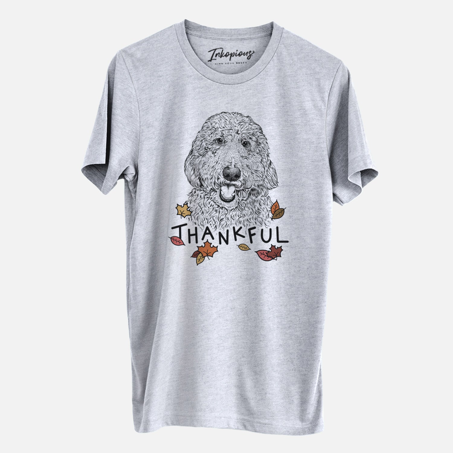 Hand-drawn sketch of Whisper the Goldendoodle with 'Thankful' lettering and autumn leaves on a Grey Unisex crewneck