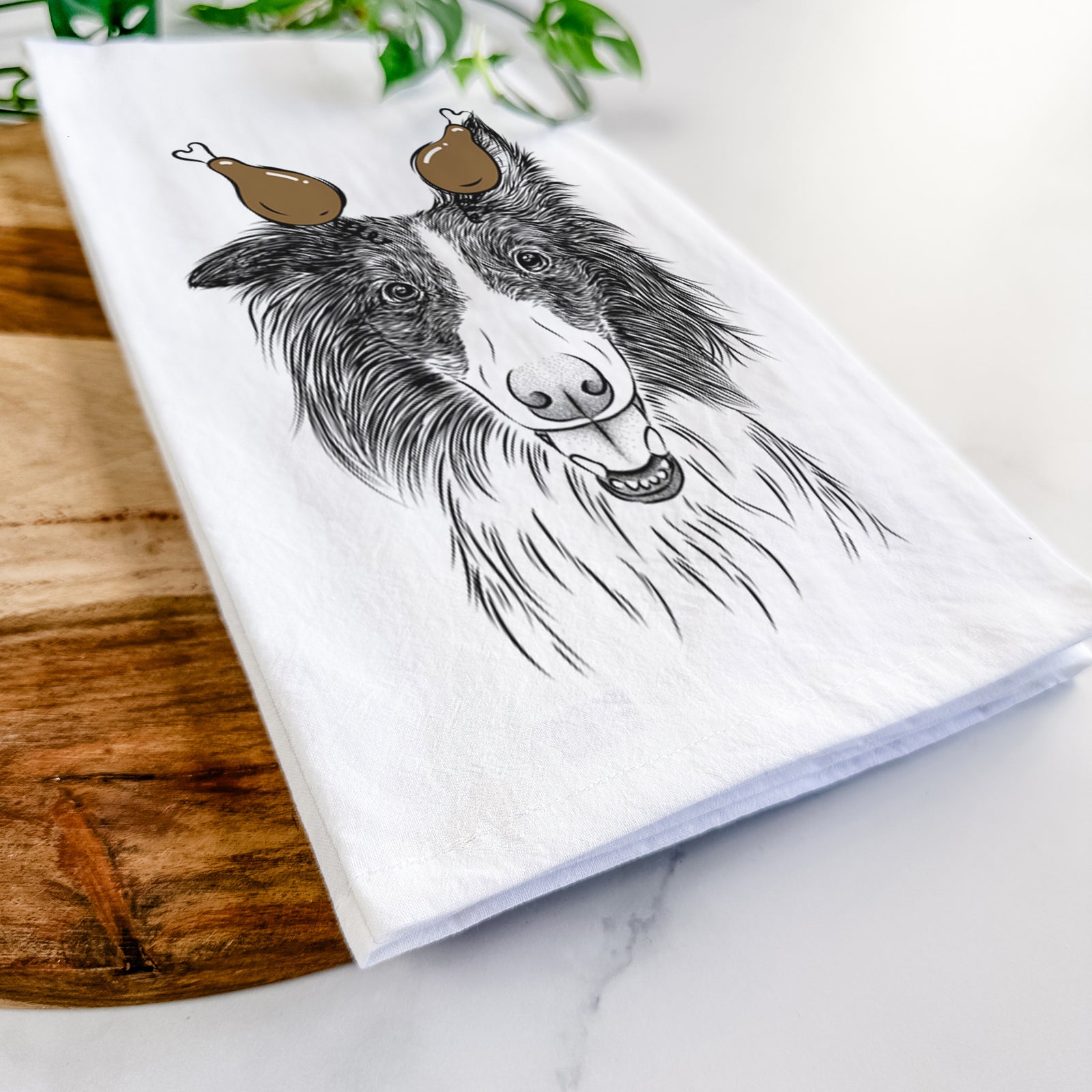 Hand-drawn sketch of Archie the Silken Windhound with a Thanksgiving turkey headpiece on a tea towel
